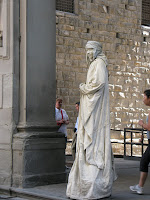 Person playing as a statue for tips