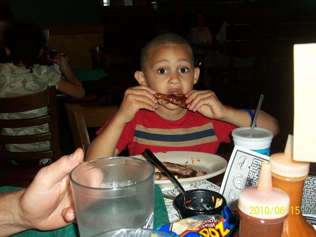 [Caleb enjoying his ribs[2].jpg]