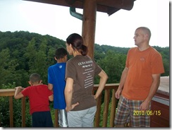 Family Looking out over Cabin rail
