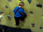 Devin mounts the climbing wall.
