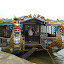 Next activity, a boat trip in Hue. Here is our fine dragon boat for the day, sweeping along the Perfume river striking dragon fear into all at shore...