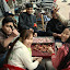 A group of locals enjoying the fun communal activity of peeling garlic!