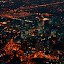 The red lights of this area, I assume the financial district, gave it an otherworldy glow.