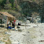 These beaches are in Tyrona National Park, where you are not allowed to build. The huts are for the fisherman but the dive schools can use them to refuel.