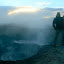 Extra terrestrial land scape, stunning sky at dawn, freezing cold couple.