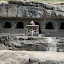 Lynette outside another Buddhist temple, again carved into the cliff face.