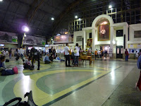 Waiting for our first Thai train in Bangkok train station! The King is everywhere!