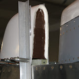 I began closing the backside of the three stabilizer fairings by epoxying a cardboard rib across the opening.  These dried while attached to the plane so they would be holding the right shape.  The VS rib in particular was crooked until I put some braces on each side and a shim the left.