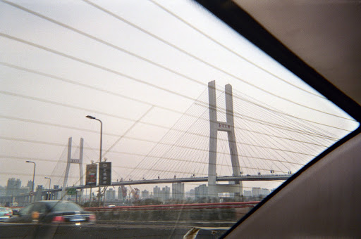 This is the Nanpu Bridge connecting Shanghai and Pudong. It's about the tallest thing in Shanghai, and it needs a 1/4 mile wide spiral ramp just to get up to.