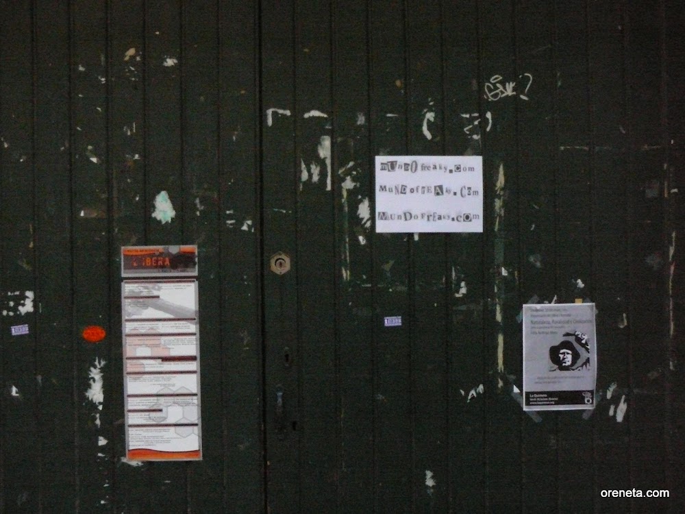 The defaced front door of Gracia's petit bourgeois-anarchist-romantic-vegetarian clique, Rosa de Foc