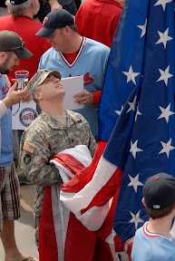 Benson raises flag at Twins game
