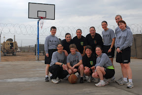 Female teams representing the 34th and 1st Infantry Divisions met on the basketball court to put a different spin on the usual transition between incoming and outgoing units at Contingency Operating Base Basra, Iraq, Jan 24. The game continued the tradition of friendly rivalry between incoming and outgoing units at COB Basra.