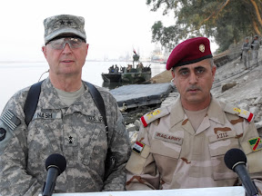 Maj. Gen. Rick Nash and Staff Major General Abdul Aziz Aswadi field questions during a joint press conference Oct. 27 in Basrah. Nash and Aswadi declared their partnership a success, citing improvements in border security and checkpoint security. (U.S. Army Photo by Spc. John Angelo)
