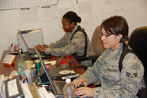 Mental health technicians, Senior Airman Stephanie DeVries and Senior Airman Courtney Weatherspoon work the front desk at the 732nd Combat Stress Control Detachment June 5, at Contingency Operating Base Adder, Iraq. The CSC has multiple experts to provide aid in many different areas of mental health concern. (U.S. Army photo by Spc. Bradley J. Clark)