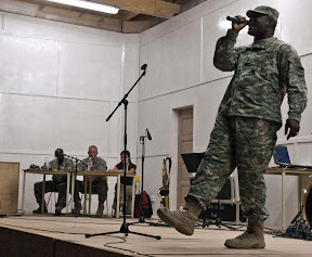 Spc. Cleon Shack performs in round two of Basra Idol, a music contest held in Basra May 23. Shack was one of three finalists to make it to the final round, held May 30 at 6:00 p.m. at the stage next to Dining Facility 1.(U.S. Army photo by Pfc. J.P. Lawrence)