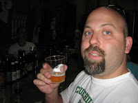 Ivan Derezin owner of Chruchill's Pub & Grill sampling a 10 year old Olde English 800 Malt Liquor