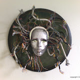 Medusa, K.M. Newton, 2006  Medium: wood, paint, network cables, found objects   Dimensions: 28 inches by 28 inches