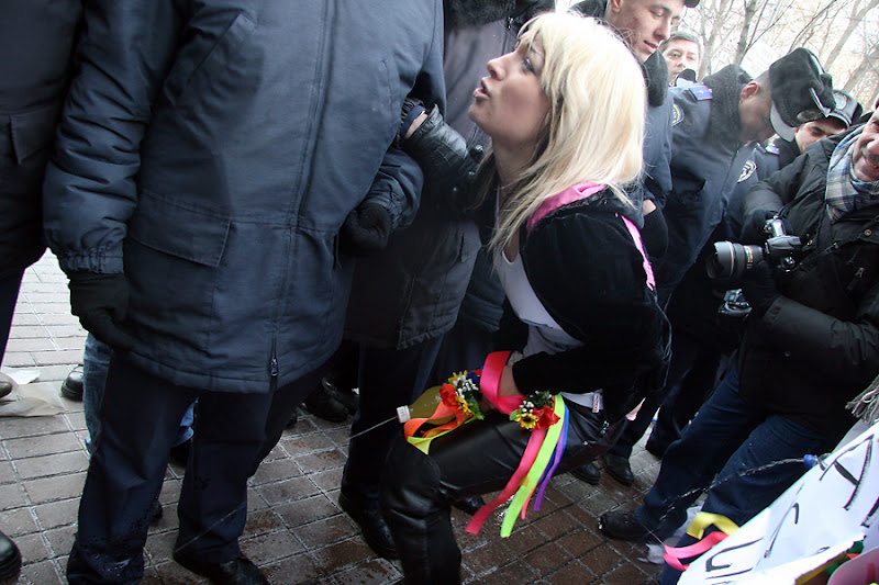 Ukrainian protest simulates Urination at Parliament Front Door