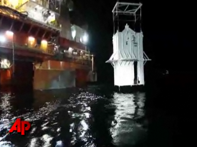 Exclusive raw video: Oil containment box lowered. AP Exclusive raw video shows workers easing a giant concrete-and-steel box into the Gulf of Mexico late Thursday, starting the long process of lowering the contraption over the blown-out oil well. (May 6)