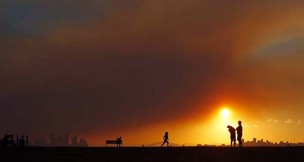 Herald photographers catch the dramatic skyline over the city as a large hazard reduction burn off in the Blue Mountains blows back over the city. Dramatic sunset from Dover Heights. Photo: Quentin Jones