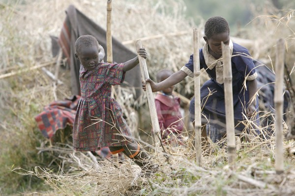 Children play at a camp in Kurbanyat, where displaced Ogiek tribespeople have been sent after being evicted from the edges of the Mau Forest as the government undertakes a project to revive the forest. (STEPHEN MORRISON, EPA / December 9, 2009)