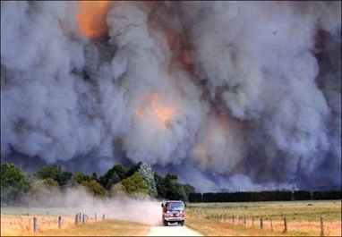 A fire truck races from a blaze in Victoria, Australia.