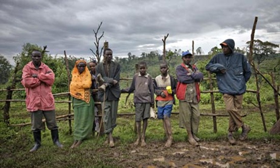 Some of the residents of the Mau forest in Kenya stand by the roadside. Photograph: Finbarr O'Reilly / Reuters
