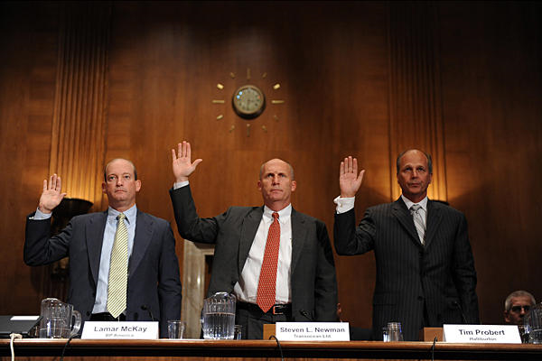 Tim Probert (r.) of Halliburton is sworn in along with officials from BP and Transocean before Senate hearings on the Gulf oil spill May 11, 2010. Tim Sloan / AFP / Newscom