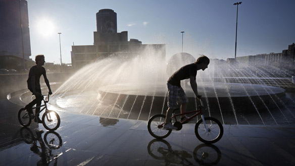Boys cool off at a fountain in the Ural Mountains city of Yekaterinburg, east of Moscow, on Thursday. Alexander Zemlianichenko / Associated Press