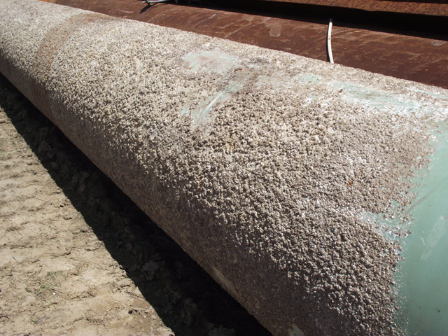 Barnacles cover steel pipe used as pilings in the boom system at Perdido Pass. The pipes were installed in June. The last pilings from the system were removed in August. Press-Register / Guy Busby