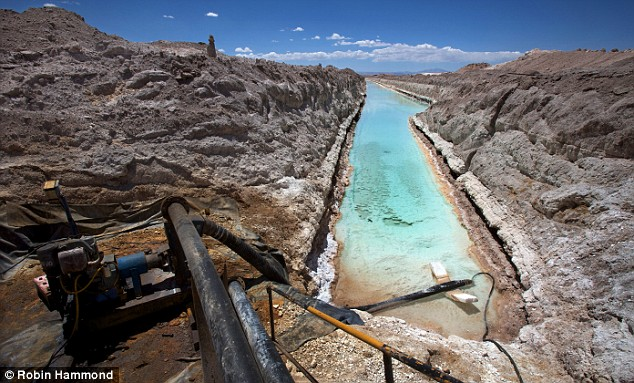 Polluted water, blue with chlorine, at a lithium mine in the Atacama desert, Chile. This is the fate of the freshwater to be diverted from southern Chile.  Robin Hammond / dailymail.co.uk