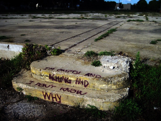 I'm empty and aching and I don't know why: Eric Shantz and the underground grassroots group 'Paint Saginaw' have been painting the lyrics to Simon & Garfunkel's 'America' around Saginaw, Michigan. Credit: Eric Shantz
