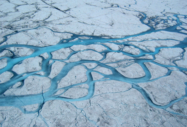 Large moulin on the surface of the Greenland ice sheet. Two recent studies of ice sheet motion and melting suggest that surface melting can produce dramatic drainage and seismic shifting on the Greenland Ice Sheet. But, surface melt that eventually lubricates the bottom of the ice sheet and accelerates its slide over bedrock may not be enough, by itself, to cause catastrophic loss of ice sheet mass. This research appeared in the 17 April 2008 issue of Science Express. Image courtesy of Science