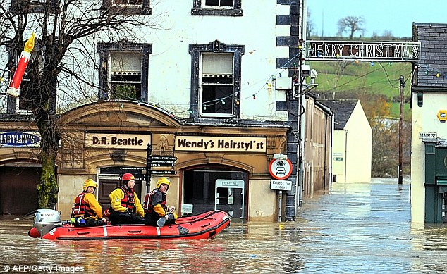 Merry Christmas? Not this year for these underwater homes and businesses in Cockermouth, Cumbria, 21 November 2009. dailymail.co.uk