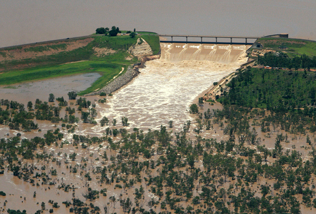 This aerial photo taken on December 31, 2010 shows the Fairbairn Dam spilling into the Queensland town of Emerald, illustrating the extent of flooding across the area. JONO SEARLE / AFP / Getty Images