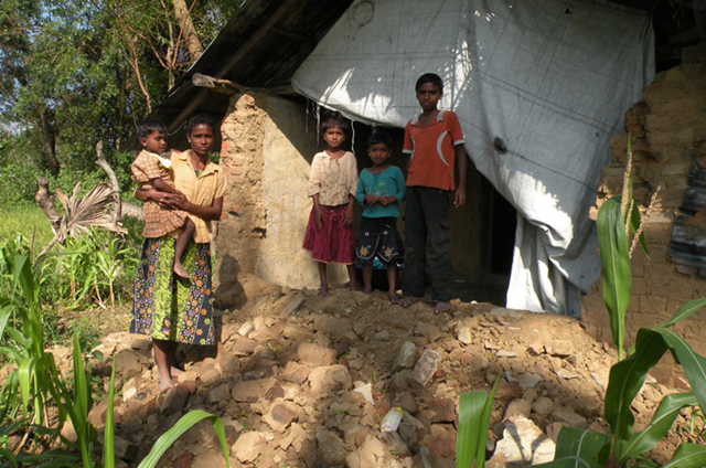 Pakyarani and her four children have returned to their flood-damaged home in a remote Sri Lanka village, but with their crops destroyed they have no way of affording food or repaying their debts, 29 January 2011. aljazeera.net