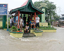 Residents wait for floodwater to subside in Cotabato City, Philippines, January 2011. ucanews.com
