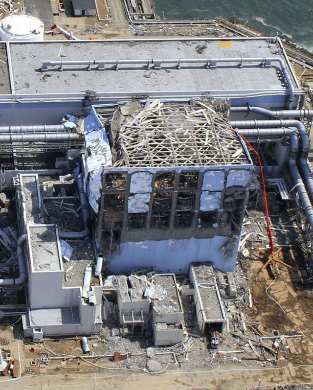 This March 24, 2011 aerial photo taken by a small unmanned drone and released by AIR PHOTO SERVICE shows damaged Unit 4 of the crippled Fukushima Dai-ichi nuclear power plant in Okumamachi, Fukushima prefecture, northern Japan. Air Photo Service Co. Ltd., Japan / cryptome.org