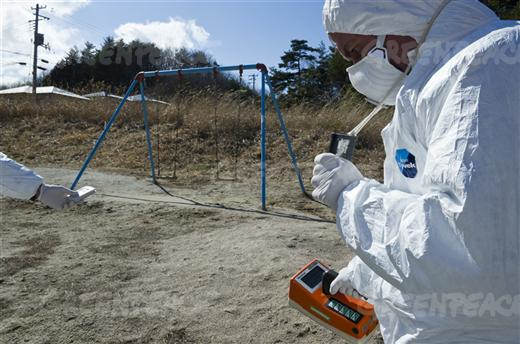 Greenpeace radiation safety experts Jan Vande Putte and Jacob Namminga monitor contamination levels at Iitate village, 40km northwest of the crisis-stricken Fukushima Daiichi nuclear plant, and 20km beyond the official evacuation zone, 27 March 2011. Radiation levels found by the Greenpeace monitoring team are far above internationally recommended limits. &copy; Christian &Aring;slund / Greenpeace