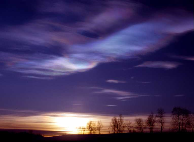 Polar stratospheric clouds in the Arctic. These Polar Stratospheric Clouds (PSC's) are composed of ice crystals that provide the surface for a multitude of reactions, many of which speed the degradation of ozone molecules. Photo Credit: Ross J. Salawitch, University of Maryland