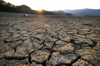 Cracked mud is picture at sunrise in the dried shores of Lake Gruyere affected by continous drought near the western Switzerland village of Avry-devant-Pont. A leading climate scientist warned on 12 April 2011 that Europe should take action over increasing drought and floods, stressing that some climate change trends were clear despite variations in predictions. Getty