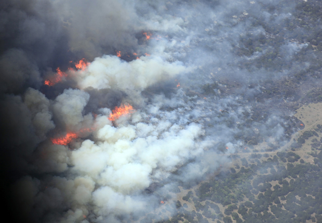 Aerial view of a wildfire near Possum Kingdom Lake where homes have been destroyed in the recreational area about 70 miles west of Fort Worth, Texas on April 19, 2011. The Dallas Morning News / David Woo