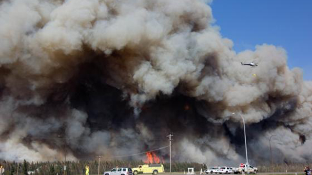A wildfire burns through Slave Lake, Alberta, Canada on 17 May 2011. In what's been called the largest-ever mass evacuation in Alberta history, thousands of Slave Lake residents are waiting to learn if their homes have been destroyed by a wildfire that has razed much of the northern Alberta town. At least 7,000 people have been forced from their homes, and fire crews are struggling against destructive flames fanned by high winds. CTV News