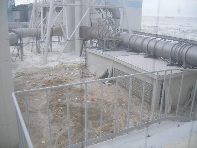 Tsunami wave inundates the Fukushima Daiichi Nuclear Power Station, 11 March 2011. The location is the north side of the Radiation Waste Treatment Facility, taken from 4th floor at approximately 3:43 PM. TEPCO