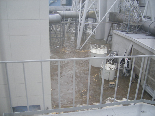 Tsunami wave inundates the Fukushima Daiichi Nuclear Power Station, 11 March 2011. The location is the north side of the Radiation Waste Treatment Facility, taken from 4th floor at approximately 3:44 PM. TEPCO