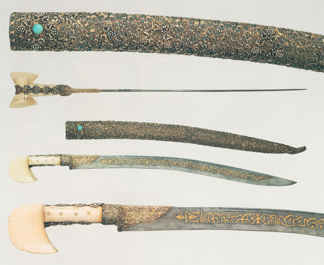 This blade bears topical inscriptions in praise of 'Ali and his sword Dhu'l-Faqar. The scabbard is tipped with a dragon's head with ruby eyes.