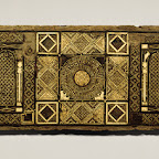 Possibly from the side of a cenotaph (a monument erected in honor of a person whose remains are elsewhere), this elaborate fig-wood panel inlaid with bone incorporates decorative elements from both the late antique and Sasanian traditions. The geometric motifs seem to derive directly from the Roman mosaic repertoire, and the carved bone plaques in the central section bear vine scrolls with a purely classical lineage. The winglike designs in the arch spandrels and the central square are of Sasanian derivation and were incorporated into the Islamic vocabulary as early as the late seventh century.