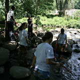 Trash gets stuck in the riffles so the wader teams fished it out.