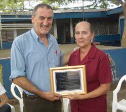 Martin Mowforth presenting Virginia Gómez Guillén with inscribed commemorative plaque to mark her retirement