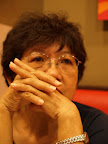 My mum with a complex expression. Does she feel sad for my leaving?